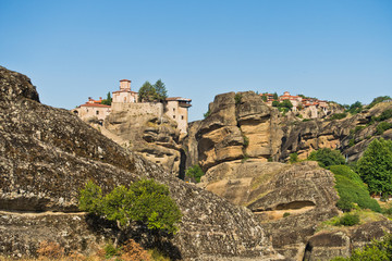 Fototapeta na wymiar Huge rocks with christian orthodox monasteries at morning above Meteora valley near Kalambaka, Thessaly, Greece