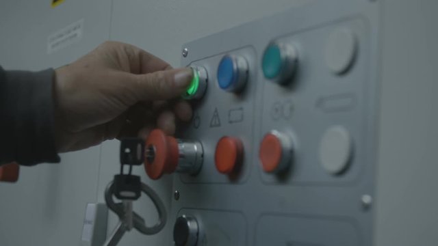 Pushing a button to turn machine on