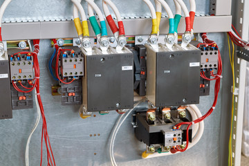 Two magnetic starters are installed in the large electrical Cabinet. Additional contacts are fixed...