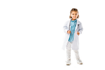 smiling kid dressed in doctors white coat with stethoscope isolated on white