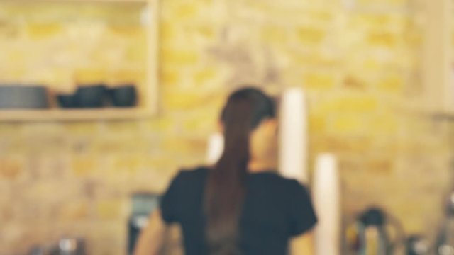 Smiling waitress giving cup of coffee to the customer