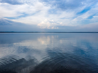 Idyllic heavenly picture - Blue sky with clouds over sea. Nature composition.