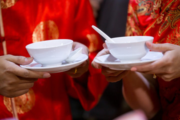 Chinese sweets dumpling from sticky rice, in syrup for serve wedding guest in wedding ceremony. image for article illustration and copy space.
