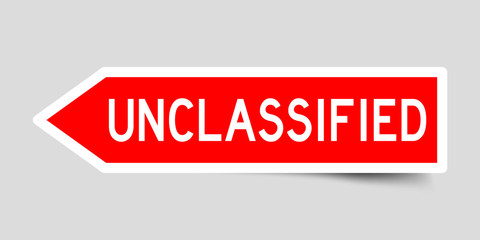 Label sticker in red color arrow shape as word unclassified on white background