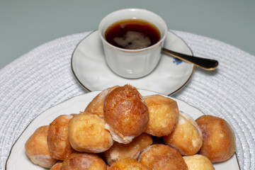 Bowl of mixed fritters with cup of coffee, Spain