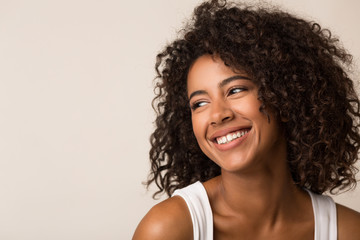 Beauty portrait of black woman on light background