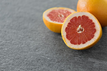 food, fruits and healthy eating concept - close up of fresh juicy grapefruits
