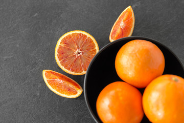 food, fruits and healthy eating concept - close up of fresh juicy blood oranges