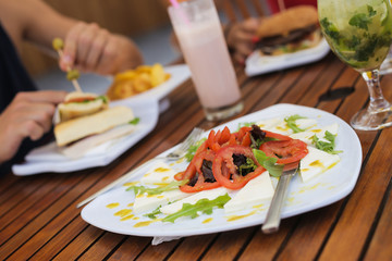 Couple lunching and drinking natural juices