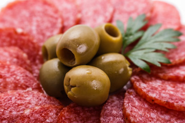 delicious sliced salami on a white background