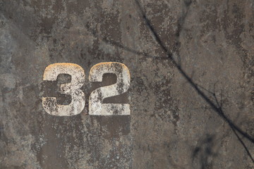 industrial background, texture of old painted metal with number 32