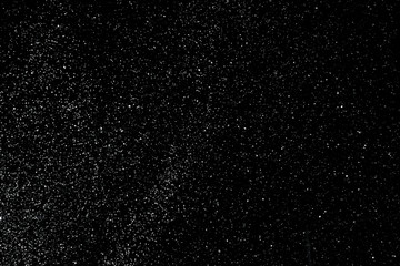 Fototapeta na wymiar snow on a black background texture overlay bokeh highlights