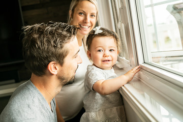 Obraz premium Family sit near window on the livingroom