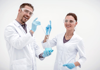 two cheerful scientists biologist on a light background