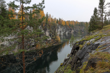 Fototapeta na wymiar Picturesque autumn landscape in the Karelian mountain park Ruskeala, Russia 