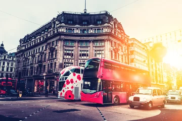 Muurstickers Oxford Street in London against golden sun ray while after work  © joeycheung
