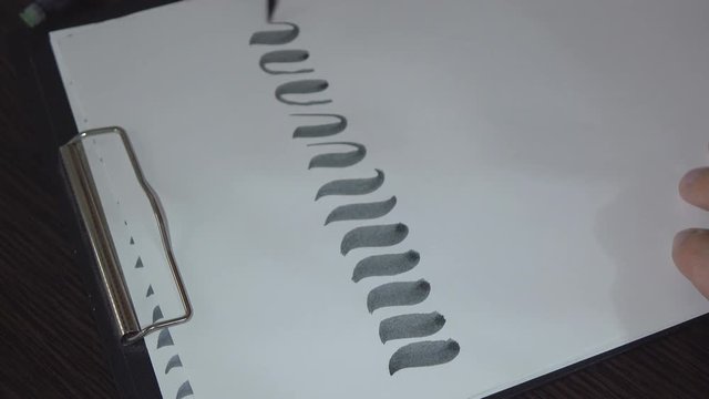 Man practiced in hand lettering with brush pen