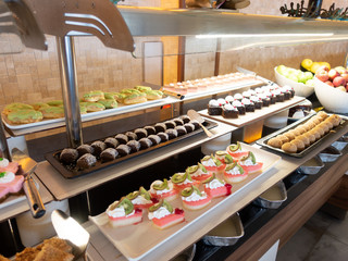 Pastries, pastries on the table in the restaurant. Hotel interior, buffet table, dessert, all...