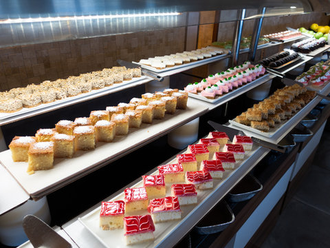 Pastries, pastries on the table in the restaurant. Hotel interior, buffet table, dessert, all inclusive.	