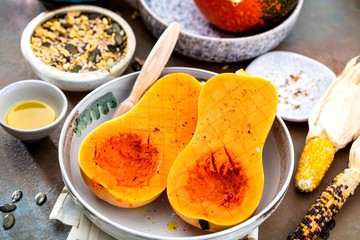 Pumpkin with different vegetables on the old wooden table top view ,Butternut