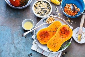 Pumpkin with different vegetables on the old wooden table top view ,Butternut