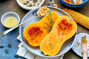 Pumpkin with different vegetables on the old wooden table top view ,Butternut