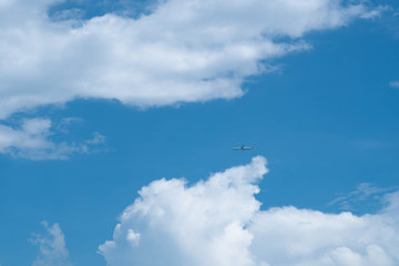 blue sky background is filled with white clouds