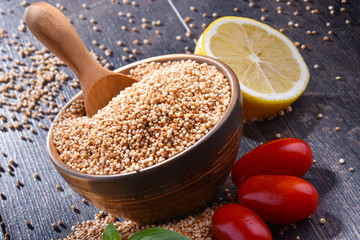 Bowl of amaranth grain on wooden table