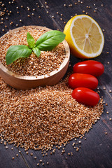 Bowl of amaranth grain on wooden table