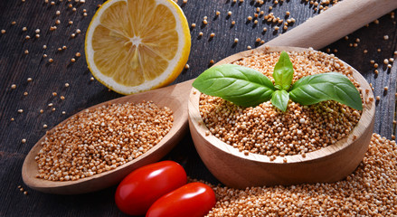 Bowl of amaranth grain on wooden table