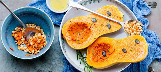 Pumpkin with different vegetables on the old wooden table top view ,Butternut
