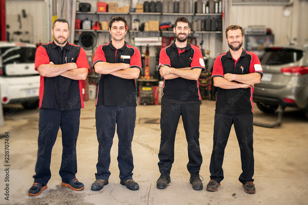 Wall mural portrait of auto shop mechanics group together employee