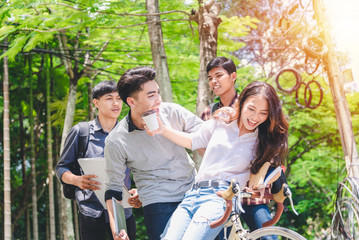 Group of students are sitting bicycle with a fun and exchange of knowledge  learning in the university educational concepts and technology.