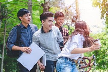 Group of students are sitting bicycle with a fun and exchange of knowledge  learning in the university educational concepts and technology.