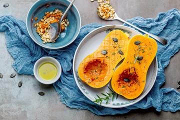 Pumpkin with different vegetables on the old wooden table top view ,Butternut