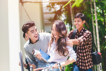 Group of students are sitting bicycle with a fun and exchange of knowledge  learning in the university educational concepts and technology.