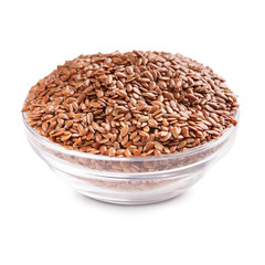 Linseeds in glass bowl isolated on white