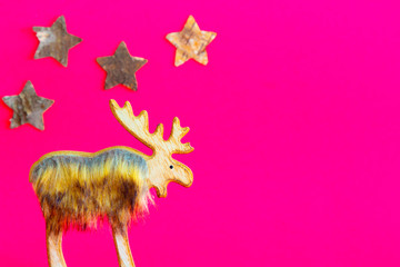 Reindeer and stars with a pink background