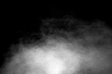 Explosion of white dust on black background.
