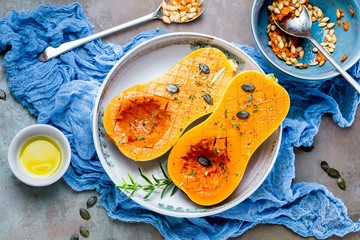 Pumpkin with different vegetables on the old wooden table top view ,Butternut
