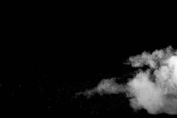 Explosion of white dust on black background.