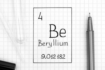 Handwriting chemical element Beryllium Be with black pen, test tube and pipette.