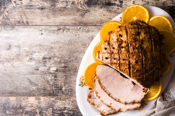 Tradicional homemade honey Glazed Ham for holidays. Top view. Copyspace