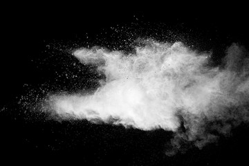 Explosion of white dust on black background. - 228711827