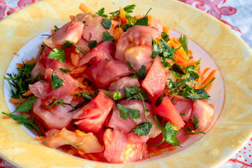 Cropped shoot of oil tomato and carrot salad