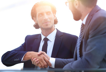 Fototapeta premium confident handshake colleagues in the office