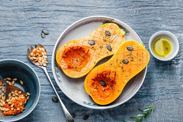 Pumpkin with different vegetables on the old wooden table top view ,Butternut