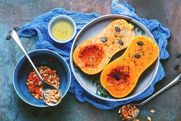 Pumpkin with different vegetables on the old wooden table top view ,Butternut