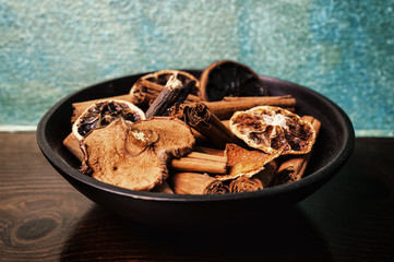 Wooden bowl with slices of dried fruit