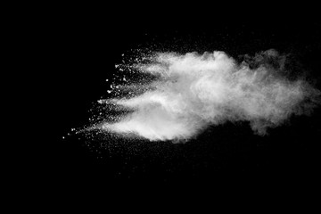 Explosion of white dust on black background. - 228713635